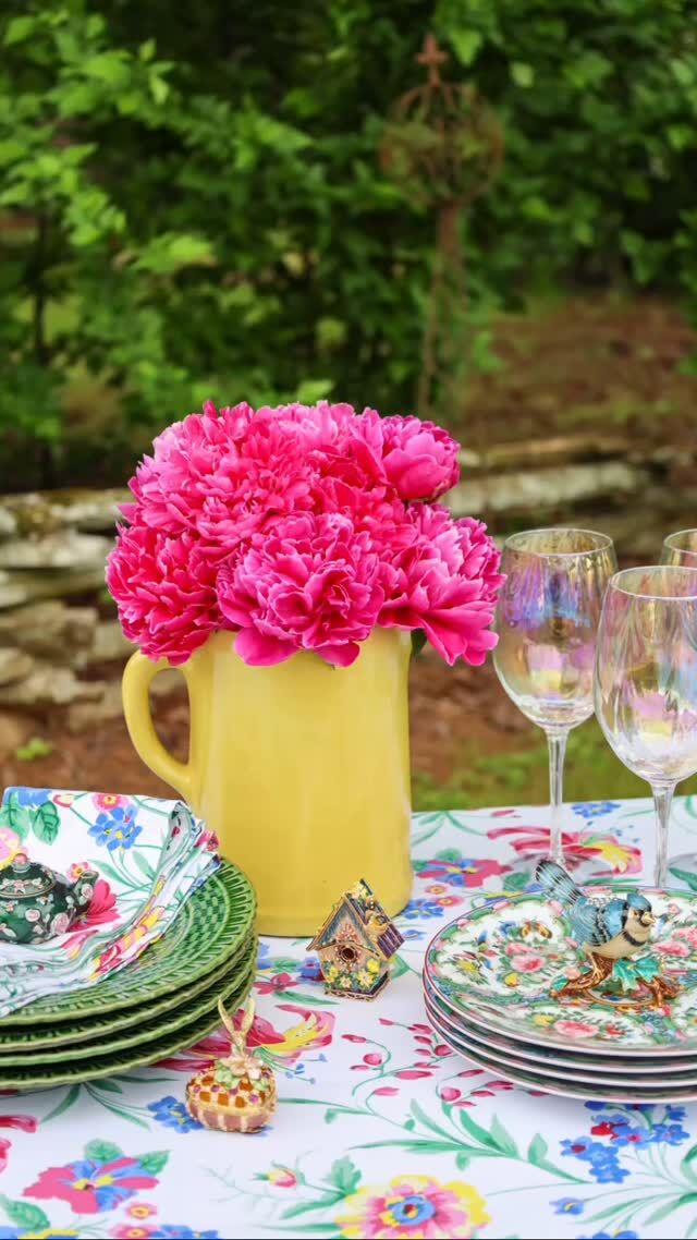 Happy Wednesday! I set a table next to our woodlands in memory of my beautiful Mother who was a lovely example of a Proverbs 31 woman. Mother had the gift of hospitality and shared it with everyone. Karl Rosenfield peonies from my garden fill a treasured keepsake pitcher handed down from my grandmother! A beautiful floral April Cornell ‘Lillianna’ tablecloth and Famille Rose salad plates elevate the status of the old picnic table next to our woodlands. I have collected bejeweled enamel trinket boxes for many years and shared a few on the table for whimsy and fun. For memories of my Mother, click the link in my profile. 

“Charm is deceitful, and beauty is vain, but a woman who fears the Lord is to be praised.” Proverbs 31:30

#aprilcornell #aprilcornellbrandambassador  #peonies #mothersday #southernladymag #victoriamagazine #famillerose #alfrescotable #everydaylivingwithbutchandpam